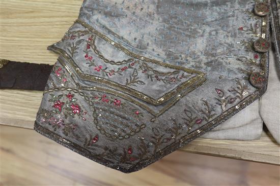 An 18th century gentlemans silver brocade and gold thread embroidered waistcoat